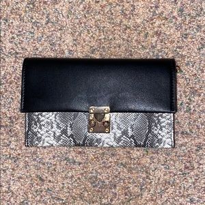 Black and snake skin purse